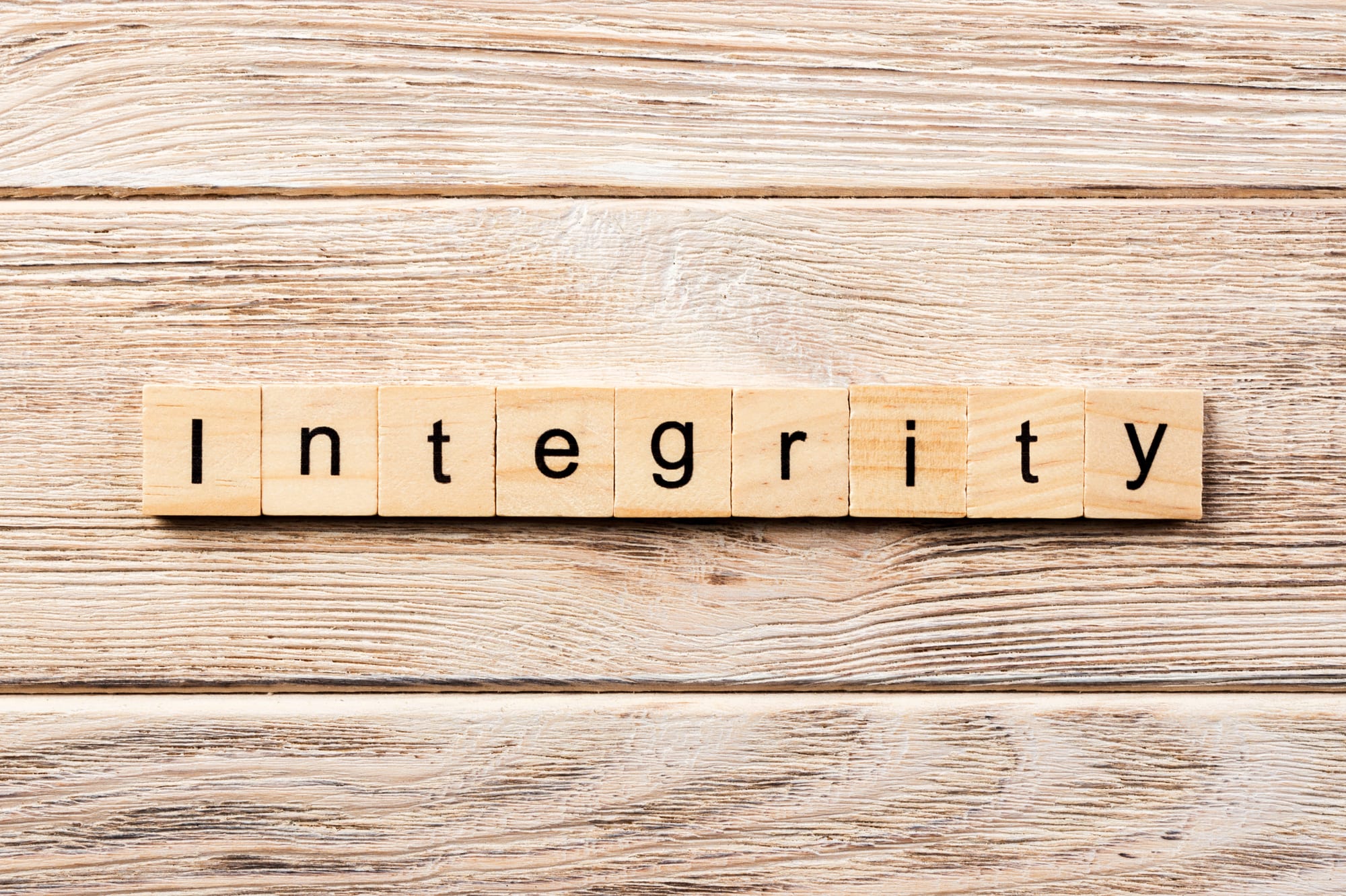 Scrabble tile spelling out the word "Integrity"